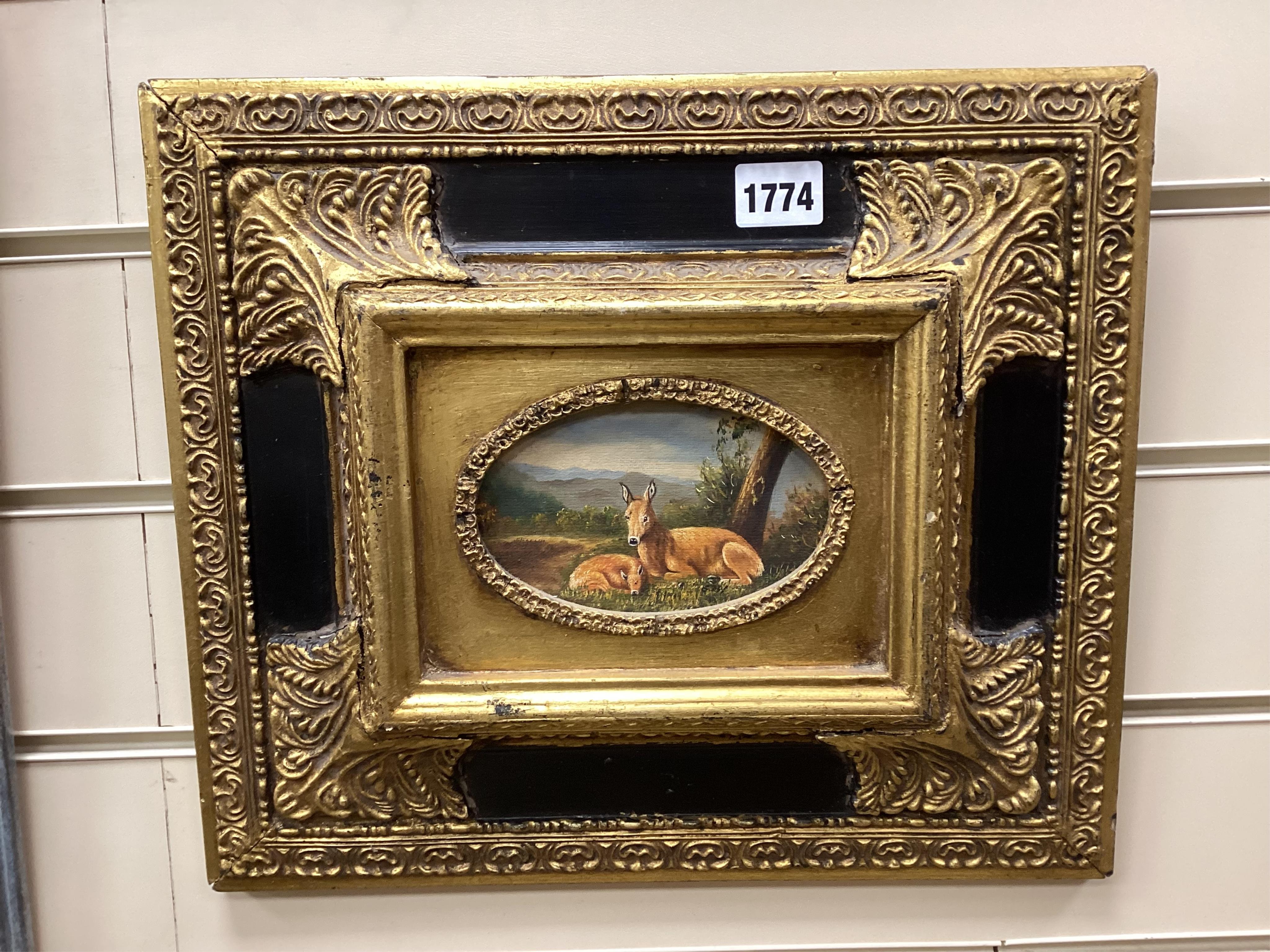 G. Roy, two deer resting beneath a tree, signed, oval oil on canvas, housed in an ebonised and gilt frame, 7.5 x 12.5cm